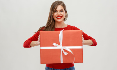 portrait of happy woman holding red gift box.