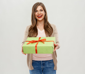 Smiling girl holding big gift box.