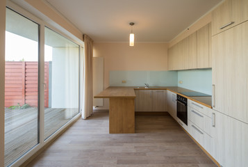 Modern home interior. Fitted kitchen in the house. The interior of the room.