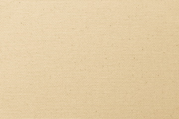 Canvas burlap fabric texture background for arts painting in beige light sepia cream tan brown pastel color