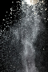 Obraz na płótnie Canvas white flour on a black background