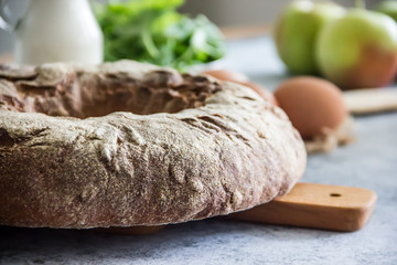 Food Background  - round fresh bread, apples, milk, greens, eggs