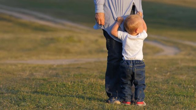 Little child asks for attention from his mother