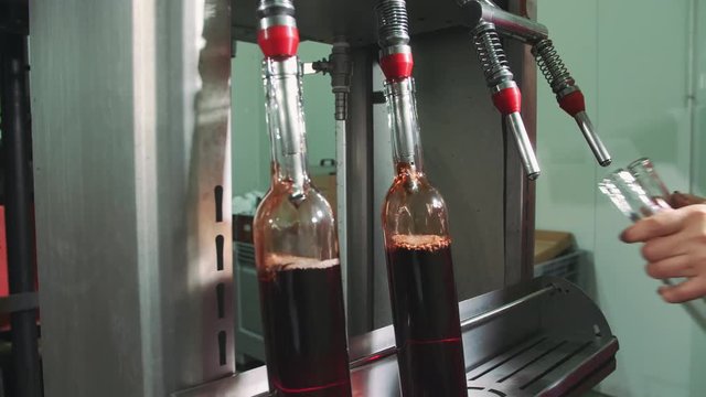 Special machine equipment bottling red wine while manufacturing