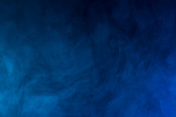 Obraz premium Colorful smoke close-up on a black background