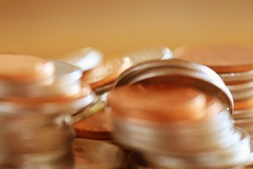 Row of coins on wood background for finance and Saving concept,Investment, Economy, Soft focus and dark style.
