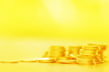 Row of coins on wood background for finance and Saving concept,Investment, Economy, Soft focus and dark style.