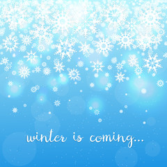 Winter is coming. Light Blue Background with snowflakes and text. Falling white snowflakes on blue background. Snow background.