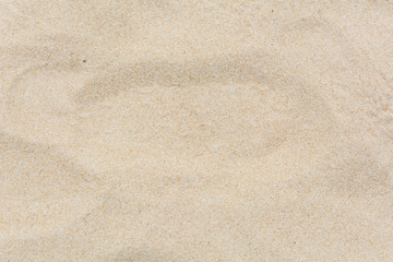 Fototapeta na wymiar Full frame shot close up of sand texture on the beach in the summer.