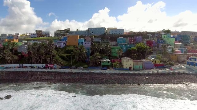 Aerial pan shot of La Perla in Old San Juan, Puerto Rico from the ocean.