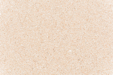 Full frame shot close up of sand texture on the beach in the summer.