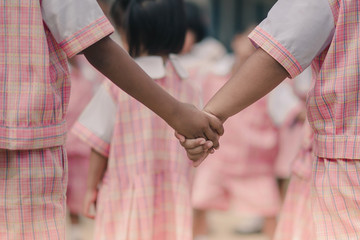 Young kids exercise in morning before class.
