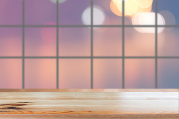 Wooden desk with Blurred light bokeh abstract background