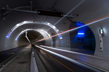 Bus driving in a tunnel for public transports, cyclist and pedestrians. Lyon, France.