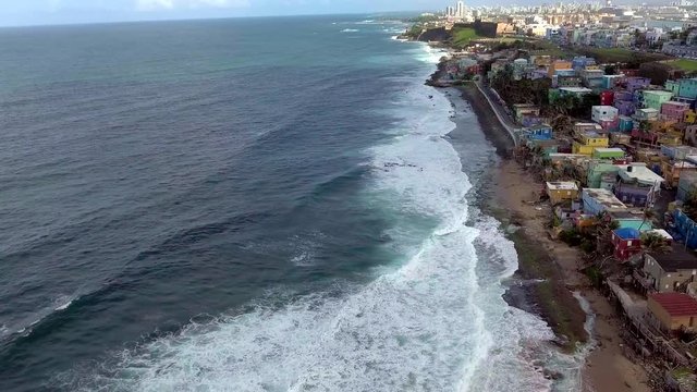 Beautiful Aerial shot over Ocean and La Perla in Old San Juan, Puerto Rico