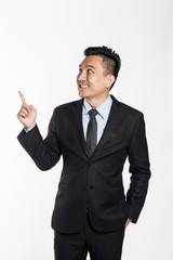 Man in suit pointing at his side, virtual concept