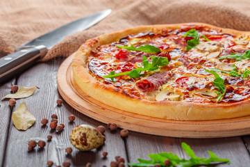 Delicious fresh pizza served on wooden table