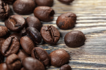 Coffee beans on wood background