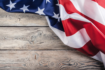 USA flag on light wooden table background close up copy space