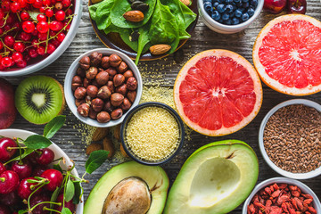 Healthy food on table. Breakfast in a bowls with super foods, vegetarian nutrition for health with fruits, vegetables and nuts