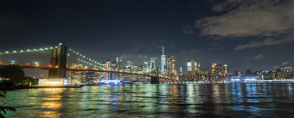 Beautiful Brooklyn Bridge on the background of the night New York cityscape