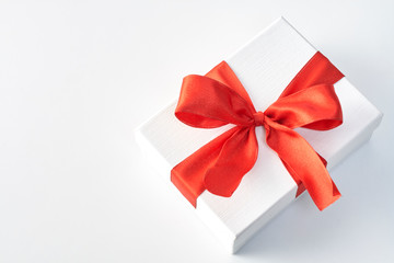 Fototapeta na wymiar Gift box with red ribbon