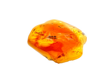 A beautiful polished shiny piece of amber with inclusions on  white background. Sunstone. Natural mineral for jewelers. Amber transparent yellow color. Amber background. Crystal. Natural mineral resin