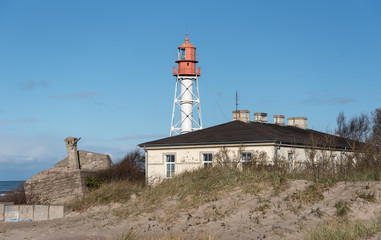 Fototapeta na wymiar Metal lighthouse at the Baltic sea.