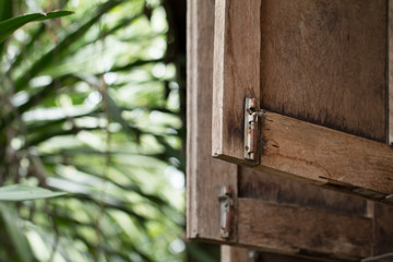 Metal old rusty lock on wooden window