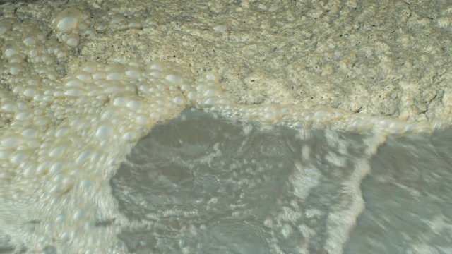 Biological purification of water sewage treatment plant waste water bubbles in the tank, clarifier activated sludge industrial wastewaters process using aeration and biology floc composed protozoa