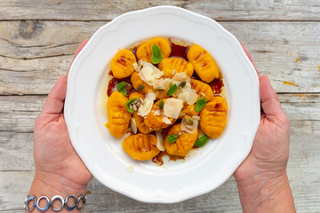 Pumpkin gnocchi with brown buttery sauce and parmesan cheese