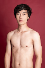 Fototapeta premium Fitness man on red background