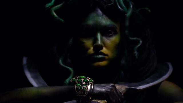 Gorgon Medusa swings her swords and lets out the battle cry