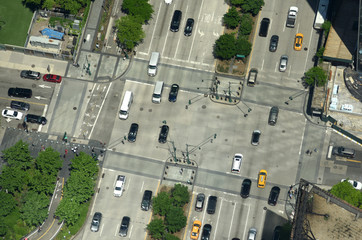 View from skyscrapers on the streets of New York City. Top view on the street with cars on the road