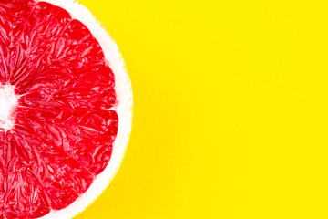 ripe grapefruit on yellow background