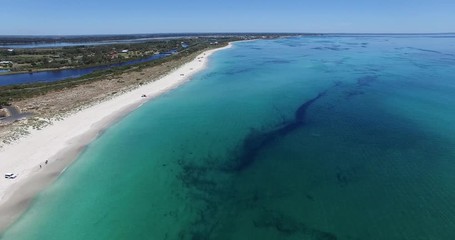 Low level flight from drone along sheltered beach towards beach goers at  Busselton Video 8