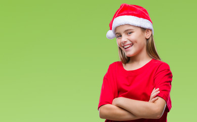 Young beautiful girl wearing christmas hat over isolated background happy face smiling with crossed arms looking at the camera. Positive person.