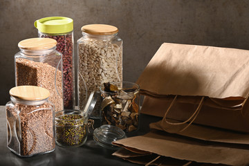 Sustainable lifestyle concept, zero waste, cereals and beas in glass, eco friendly, plastic free items. Dark background.
