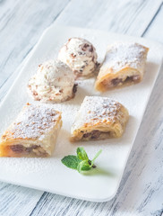 Slices of apple strudel on the white plate