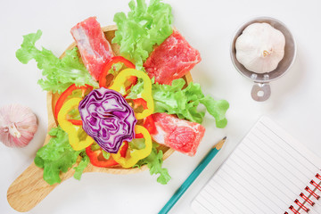 Cooking at with fresh vegetables and meat