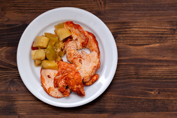 grilled turkey with vegetables on white plate