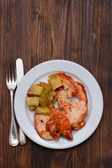 grilled turkey with vegetables on white plate