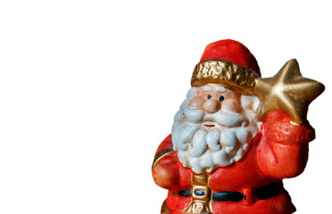 Santa Claus figure holds a star as a symbol of Christmas and new year on the white background.