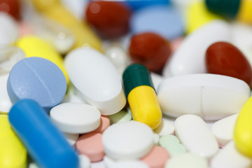 Pills and tablets close up background