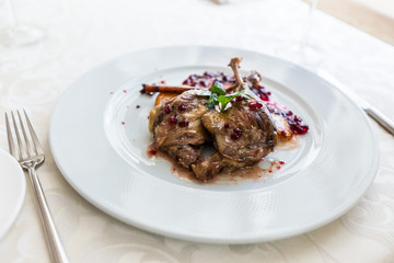 Duck leg confit with mountain cranberries sauce and pear chutney