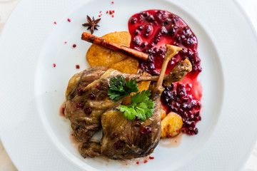 Duck leg confit with mountain cranberries sauce and pear chutney