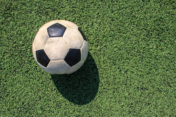 Football on artificial turf. It is for green background in a stadium