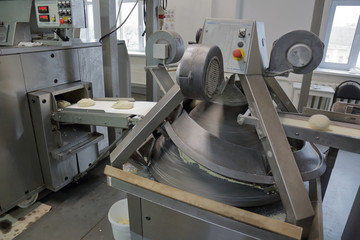 Industrial equipment and machinery at the factory of bread and sweets