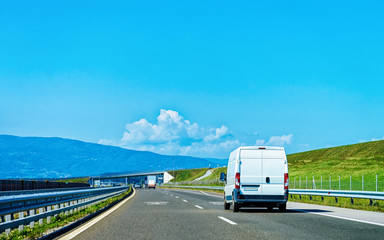 Fototapeta na wymiar Mini van in highway road in Slovenia