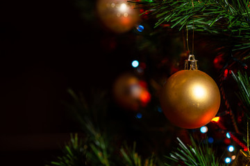 Golden christmas ball in the christmas tree